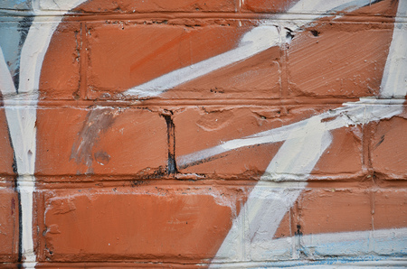 Close up view of graffiti drawing details. Background image on the theme of street art and vandalism. Texture of the wall, painted with aerosol paintsの写真素材