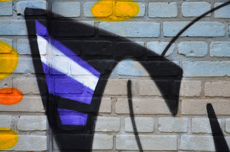 Close up view of graffiti drawing details. Background image on the theme of street art and vandalism. Texture of the wall, painted with aerosol paintsの写真素材