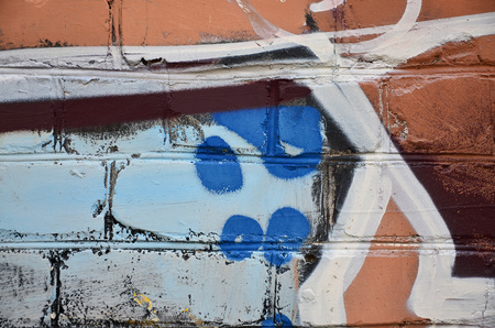 Close up view of graffiti drawing details. Background image on the theme of street art and vandalism. Texture of the wall, painted with aerosol paintsの写真素材