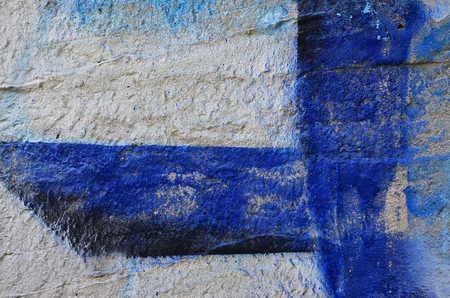 Close up view of graffiti drawing details. Background image on the theme of street art and vandalism. Texture of the wall, painted with aerosol paintsの写真素材