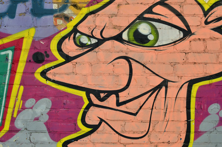 Art under ground. Beautiful street art graffiti style. The wall is decorated with abstract drawings house paint. Modern iconic urban culture of street youth. Abstract stylish picture on wallの写真素材