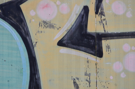 Close up view of graffiti drawing details. Background image on the theme of street art and vandalism. Texture of the wall, painted with aerosol paintsの写真素材