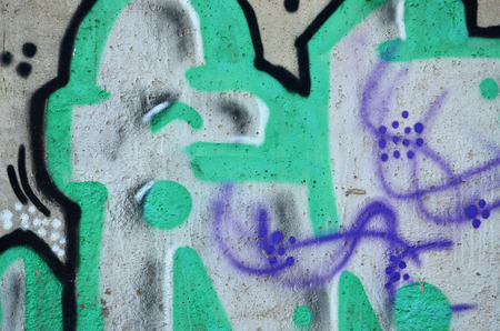 Close up view of graffiti drawing details. Background image on the theme of street art and vandalism. Texture of the wall, painted with aerosol paintsの写真素材