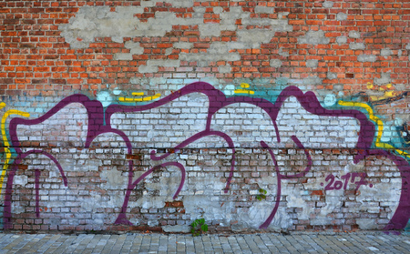 The texture of the wall with graffiti, which is depicted on it. The image of the whole and complete graffiti of the drawing as a resource for the design of 3D projectsの写真素材