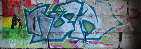 Detailed image of very old and aged color graffiti drawing on the wall. Background grunge street art pictureの写真素材