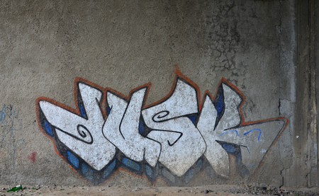 Detailed image of very old and aged color graffiti drawing on the wall. Background grunge street art pictureの写真素材