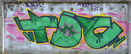 The texture of the wall with graffiti, which is depicted on it. The image of the whole and complete graffiti of the drawing as a resource for the design of 3D projectsの写真素材