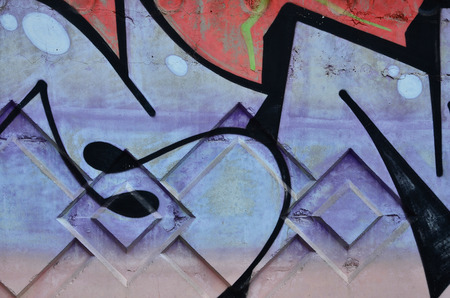 Texture of a fragment of the wall with graffiti painting, which is depicted on it. An image of a piece of graffiti drawing as a photo on street art and graffiti culture topicsの写真素材