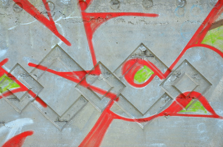 Texture of a fragment of the wall with graffiti painting, which is depicted on it. An image of a piece of graffiti drawing as a photo on street art and graffiti culture topicsの写真素材