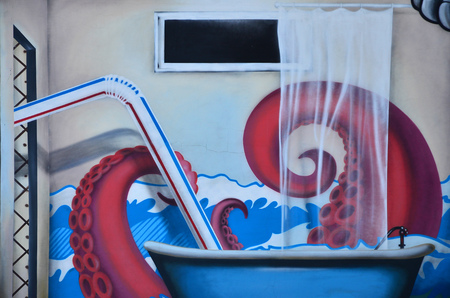 Detailed image of color graffiti drawing. Background Street art background with painted octopus bathing in the bathroomの写真素材