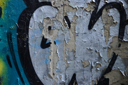 Detailed image of very old and aged color graffiti drawing on the wall. Background grunge street art pictureの写真素材