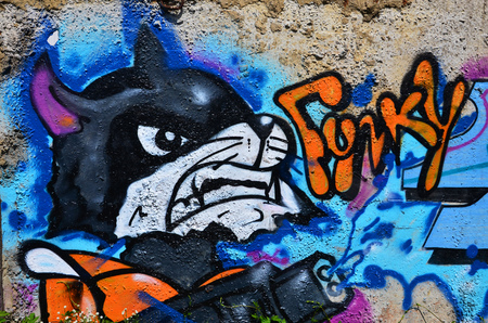 Texture of a fragment of the wall with graffiti painting, which is depicted on it. An image of a piece of graffiti drawing as a photo on street art and graffiti culture topicsの写真素材
