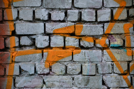 Detailed image of very old and aged color graffiti drawing on the wall. Background grunge street art pictureの写真素材