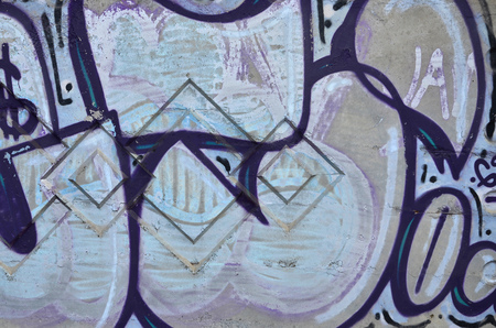Texture of a fragment of the wall with graffiti painting, which is depicted on it. An image of a piece of graffiti drawing as a photo on street art and graffiti culture topicsの写真素材