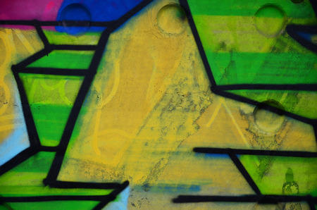 Texture of a fragment of the wall with graffiti painting, which is depicted on it. An image of a piece of graffiti drawing as a photo on street art and graffiti culture topicsの写真素材