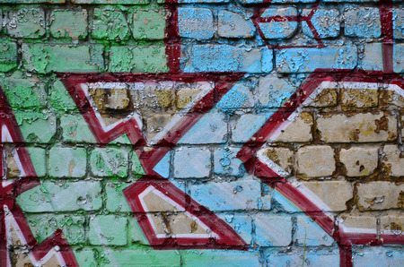 Detailed image of very old and aged color graffiti drawing on the wall. Background grunge street art pictureの写真素材