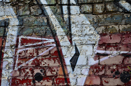 Detailed image of very old and aged color graffiti drawing on the wall. Background grunge street art pictureの写真素材