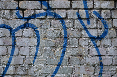 Detailed image of very old and aged color graffiti drawing on the wall. Background grunge street art pictureの写真素材