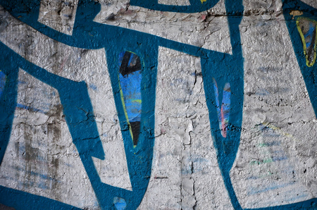 Detailed image of very old and aged color graffiti drawing on the wall. Background grunge street art pictureの写真素材