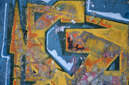 Detailed image of very old and aged color graffiti drawing on the wall. Background grunge street art pictureの写真素材