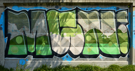 The texture of the wall with graffiti, which is depicted on it. The image of the whole and complete graffiti of the drawing as a resource for the design of 3D projectsの写真素材