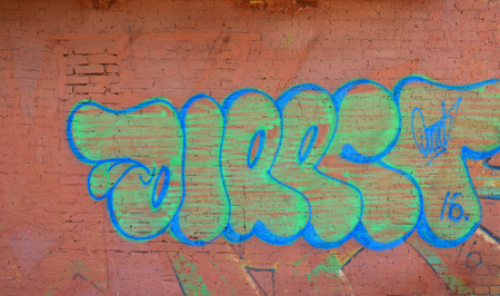 The texture of the wall with graffiti, which is depicted on it. The image of the whole and complete graffiti of the drawing as a resource for the design of 3D projectsの写真素材