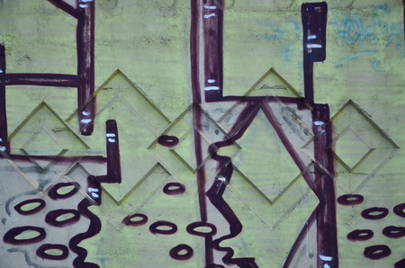 Texture of a fragment of the wall with graffiti painting, which is depicted on it. An image of a piece of graffiti drawing as a photo on street art and graffiti culture topicsの写真素材