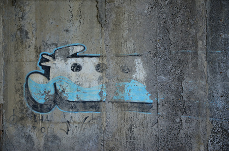 Detailed image of very old and aged color graffiti drawing on the wall. Background grunge street art pictureの写真素材