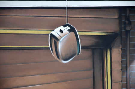 Detailed image of color graffiti drawing. Background Street art background depicting a hanging toasterの写真素材