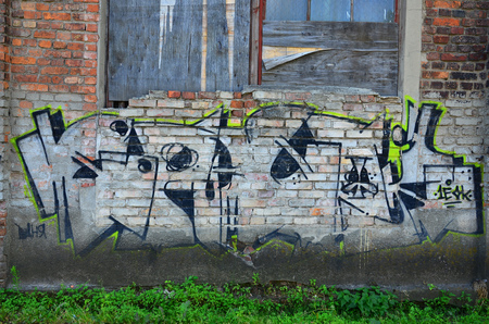 The texture of the wall with graffiti, which is depicted on it. The image of the whole and complete graffiti of the drawing as a resource for the design of 3D projectsの写真素材