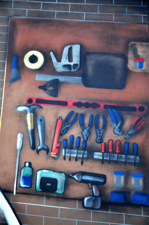 Detailed image of color graffiti drawing. Background Street art background with painted stand of car repair toolsの写真素材