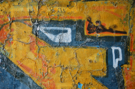 Detailed image of very old and aged color graffiti drawing on the wall. Background grunge street art pictureの写真素材