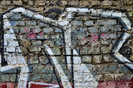 Detailed image of very old and aged color graffiti drawing on the wall. Background grunge street art pictureの写真素材