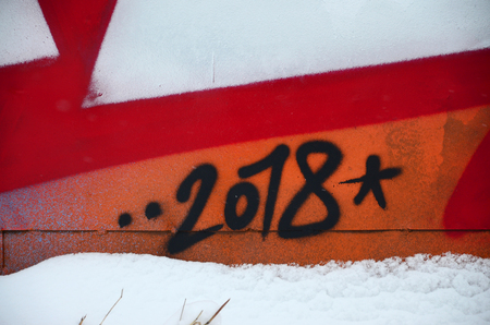 Close-up fragment of a graffiti drawing applied to the wall by aerosol paint. Background image of a modern composition of lines and colored areas. Street art conceptの写真素材