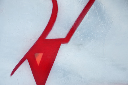 Close-up fragment of a graffiti drawing applied to the wall by aerosol paint. Background image of a modern composition of lines and colored areas. Street art conceptの写真素材