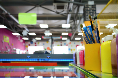 Art paint brushes in cup are located in the children's entertainment hallの写真素材