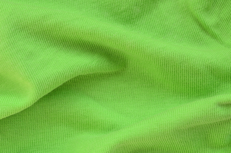 The texture of the fabric is bright green. Material for making shirts and blousesの写真素材