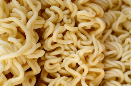Close up view of yellow dry instant noodles. Chinese traditional food