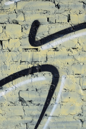 The old wall, painted in color graffiti drawing red aerosol paints. Background image on the theme of drawing graffiti and street artの写真素材