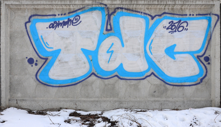 The old wall, painted in color graffiti drawing red aerosol paints. Background image on the theme of drawing graffiti and street artの写真素材