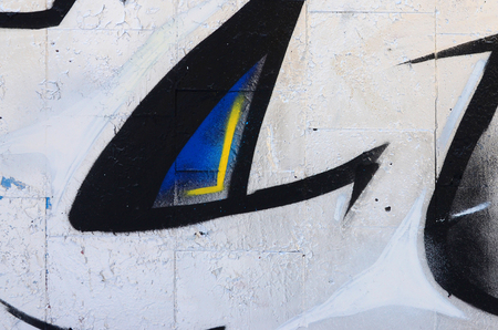 The old wall, painted in color graffiti drawing red aerosol paints. Background image on the theme of drawing graffiti and street artの写真素材