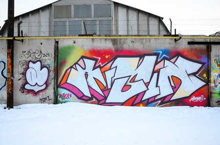 The old wall, painted in color graffiti drawing red aerosol paints. Background image on the theme of drawing graffiti and street artの写真素材