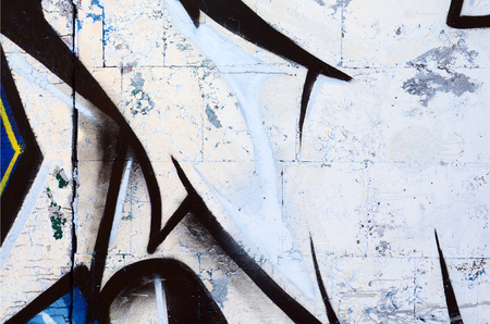 The old wall, painted in color graffiti drawing red aerosol paints. Background image on the theme of drawing graffiti and street artの写真素材