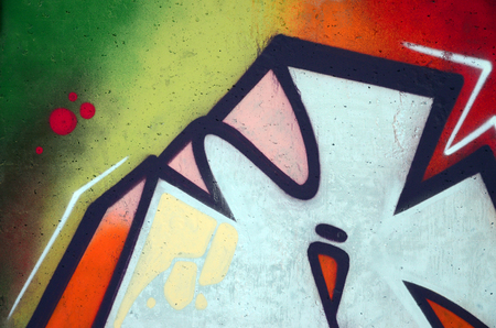 The old wall, painted in color graffiti drawing red aerosol paints. Background image on the theme of drawing graffiti and street artの写真素材