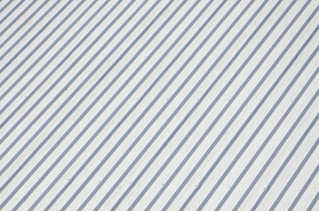 Metal gray roof with rhythmic parallel relief directions