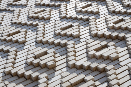 A pattern made of white bricks in the form of diamond shapes. Decoration of the walls during the Soviet Unionの写真素材