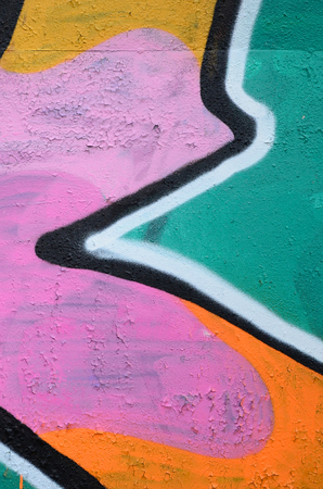 Fragment of a beautiful graffiti pattern in pink and green with a black outline. Street art background imageの写真素材