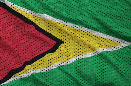 Guyana flag printed on a polyester nylon sportswear mesh fabric with some foldsの写真素材