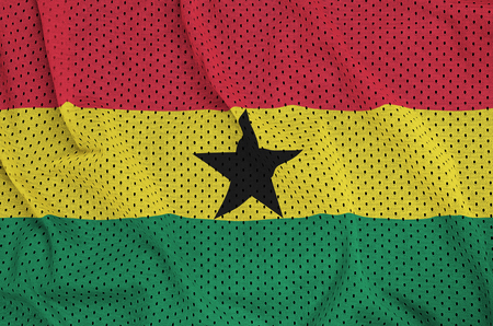 Ghana flag printed on a polyester nylon sportswear mesh fabric with some foldsの写真素材