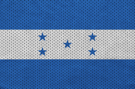 Honduras flag printed on a polyester nylon sportswear mesh fabric with some foldsの写真素材